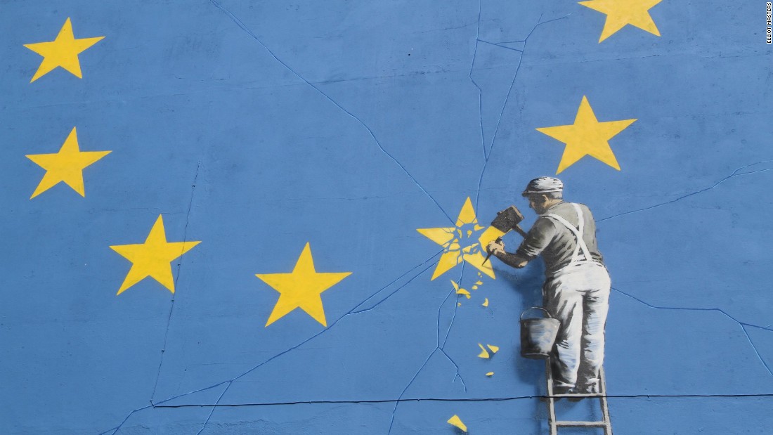 The GDPR A person on a ladder chiseling away one of the stars in the EU banner