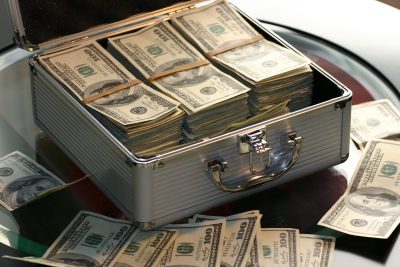 Powerful Xero Functions An opened briefcase on a table, full of dollar bills