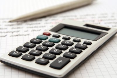 Powerful Xero Functions A simple calculator next to a pencil on paperwork