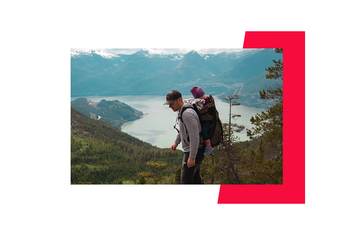 A scenic view of hiking in the mountains with two people in view