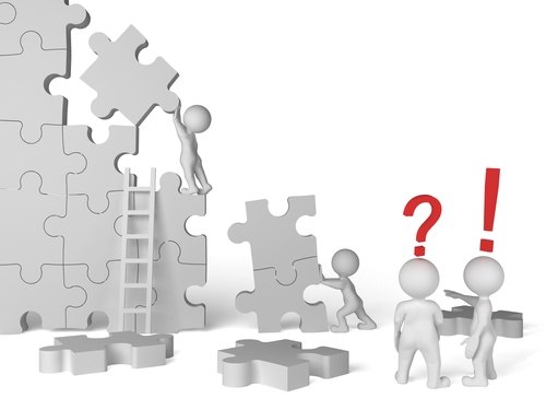 This type of leader is Laissez-faire graphic of figures putting together a giant puzzle